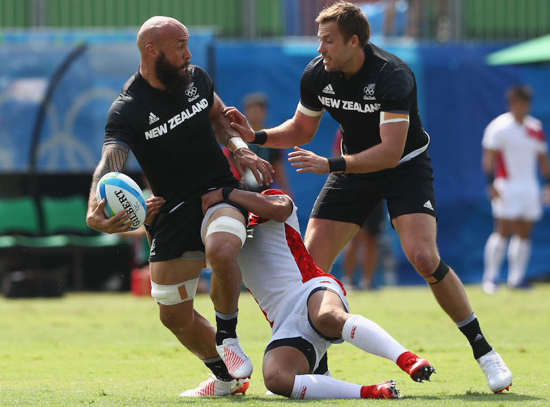 New Zealand’s Tim Mikkelson is back in the drama AGAIN during the Pool C match between New Zealand and Japan as he approaches teammate DJ Forbes, who is currently kind of busy having a heart-to-heart with Kazuhiro Goya of Japan. Image via Getty.